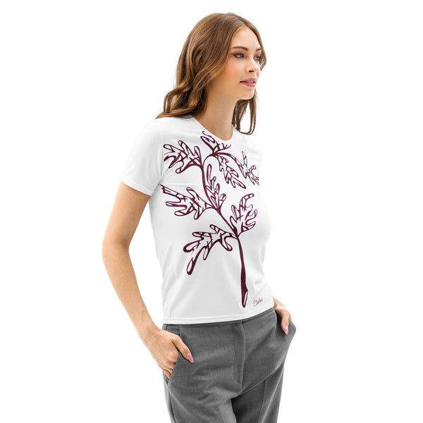 Woman wearing a white t-shirt with cranberry leaf and branch design on a white background