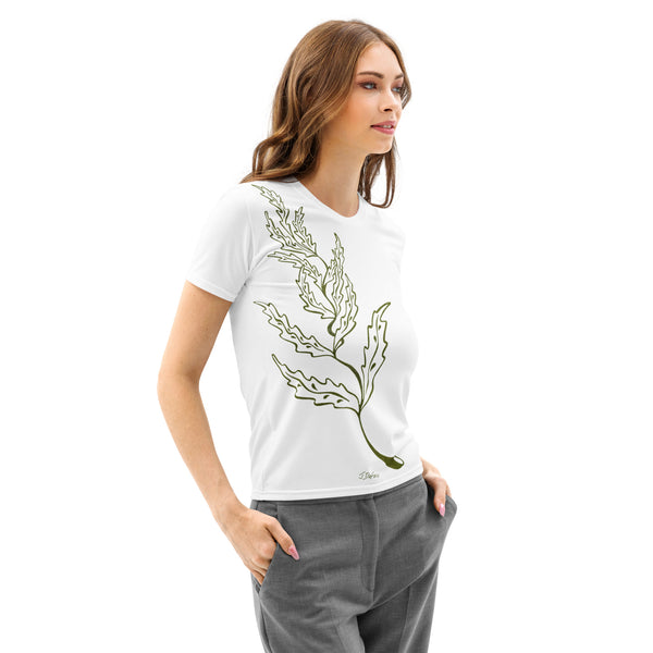 Woman wearing a white t-shirt with a green leaf design on a white background