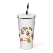 White tumbler with graphic dancing leaves printed on it 