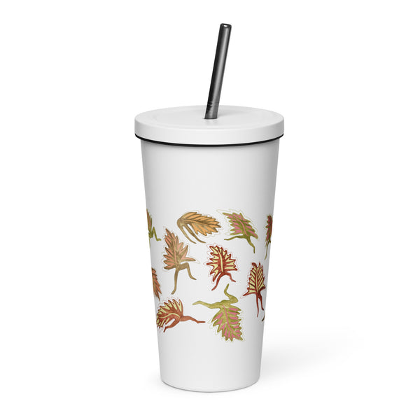 White tumbler with graphic dancing leaves printed on it 