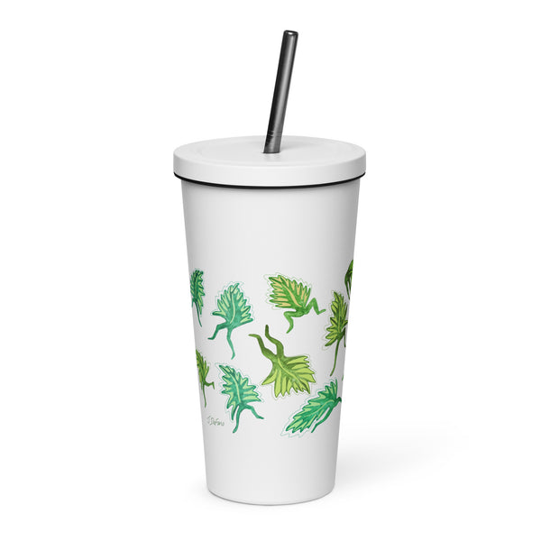 White tumbler with green leaf patterns and a stainless straw on a white background