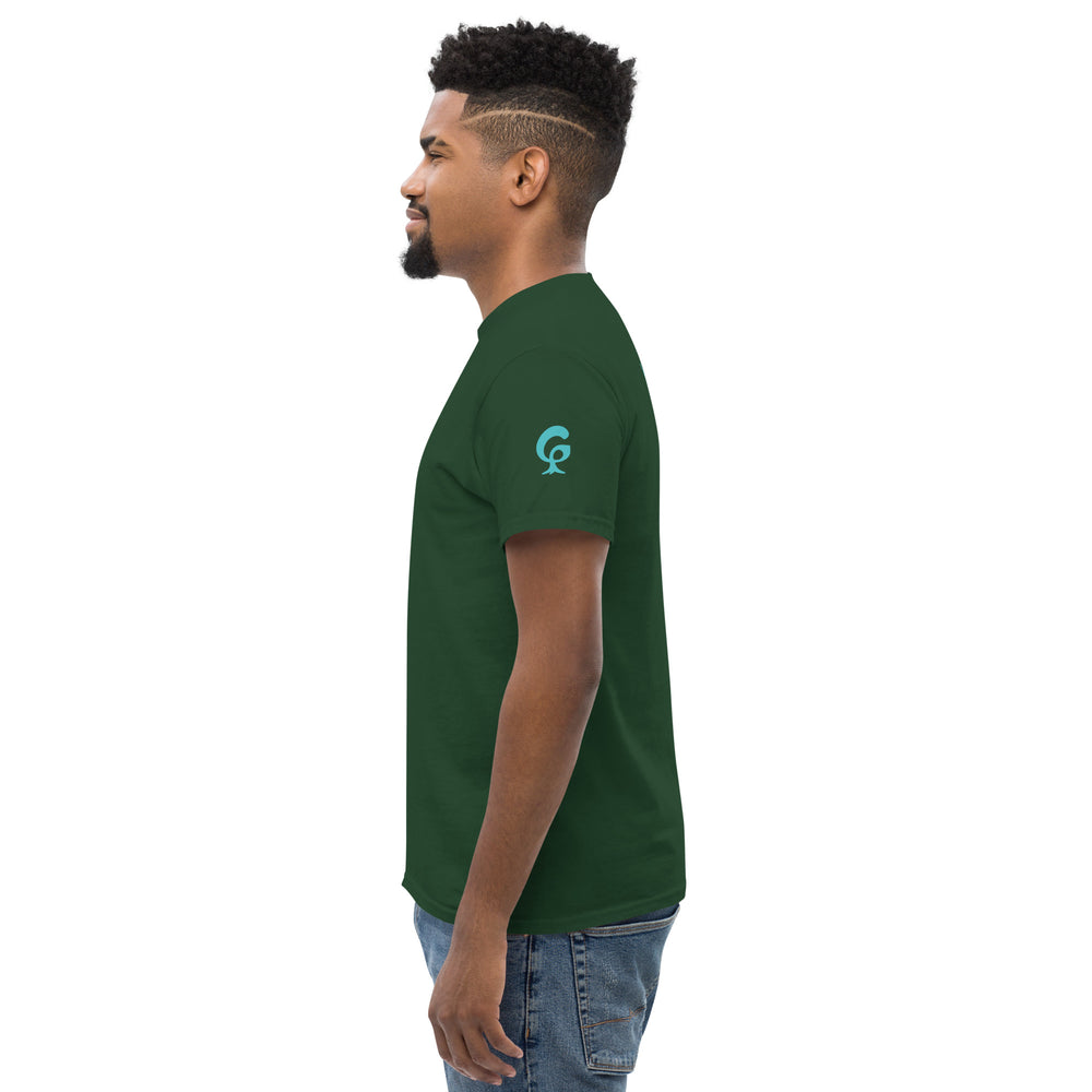 Man wearing a green t-shirt with a logo on a the left sleeve