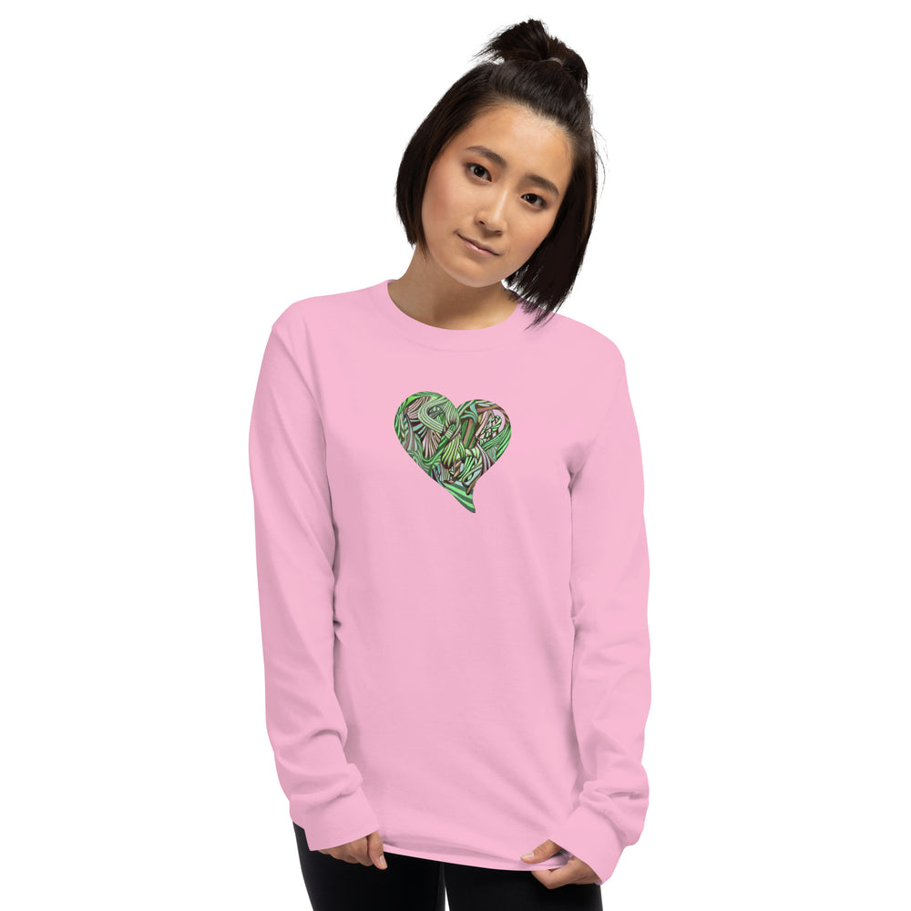 Person wearing a pink long-sleeve shirt with a green heart design on a pink background