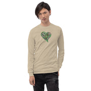 Person wearing a beige long-sleeve shirt with a green heart design on a beige background