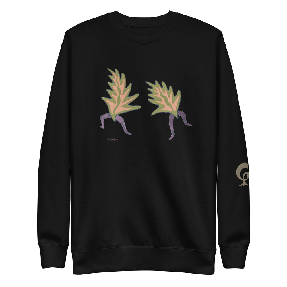 Black sweatshirt with dancing leaves on black background