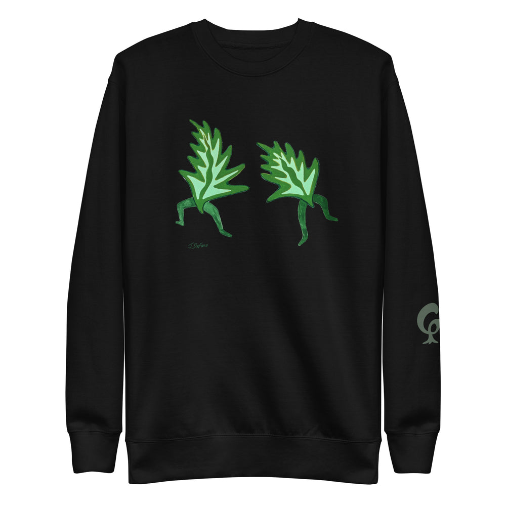 Black sweatshirt with dancing leaves on a black background