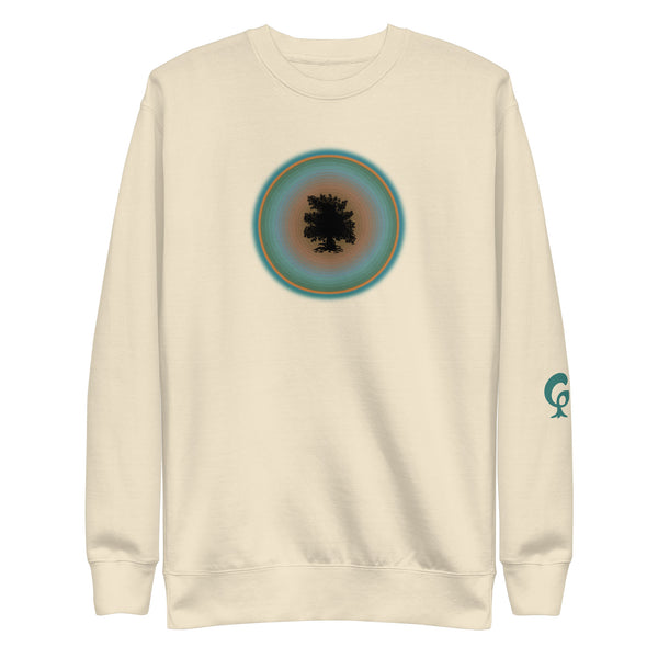 Cream sweatshirt with a circular design on the chest and a logo on the sleeve against a cream background
