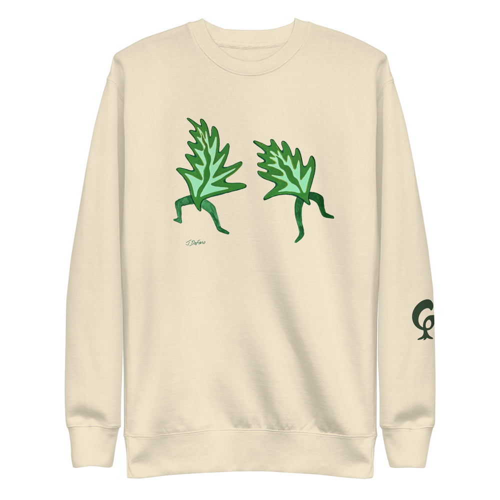 cream sweatshirt with dancing leaves on a cream background
