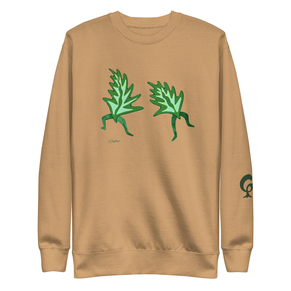 beige sweatshirt with dancing leaves on a beige background