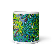 White glossy mug with colorful leaf design on white background