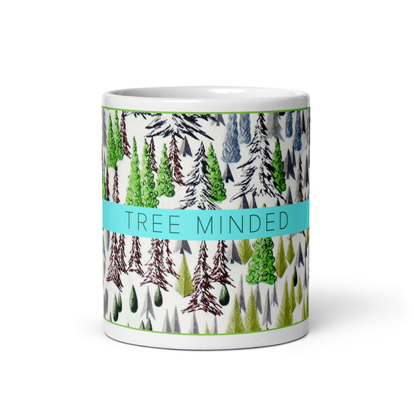 Mug with forest pattern and 'Tree Minded' text on a white background