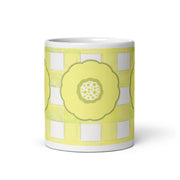 Mug with a yellow floral design on a white background