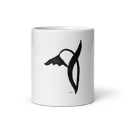 A black graphic wild flower printed on a white glossy ceramic mug