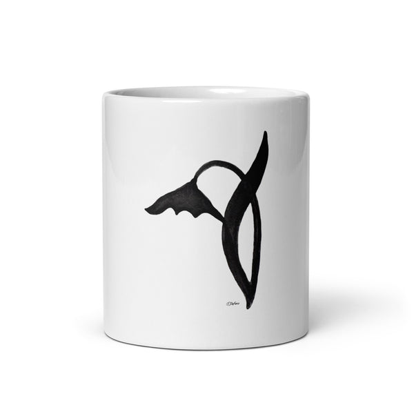 A black graphic wild flower printed on a white glossy ceramic mug