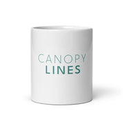 The words CANOPY LINES printed in medium teal on a white glossy ceramic mug