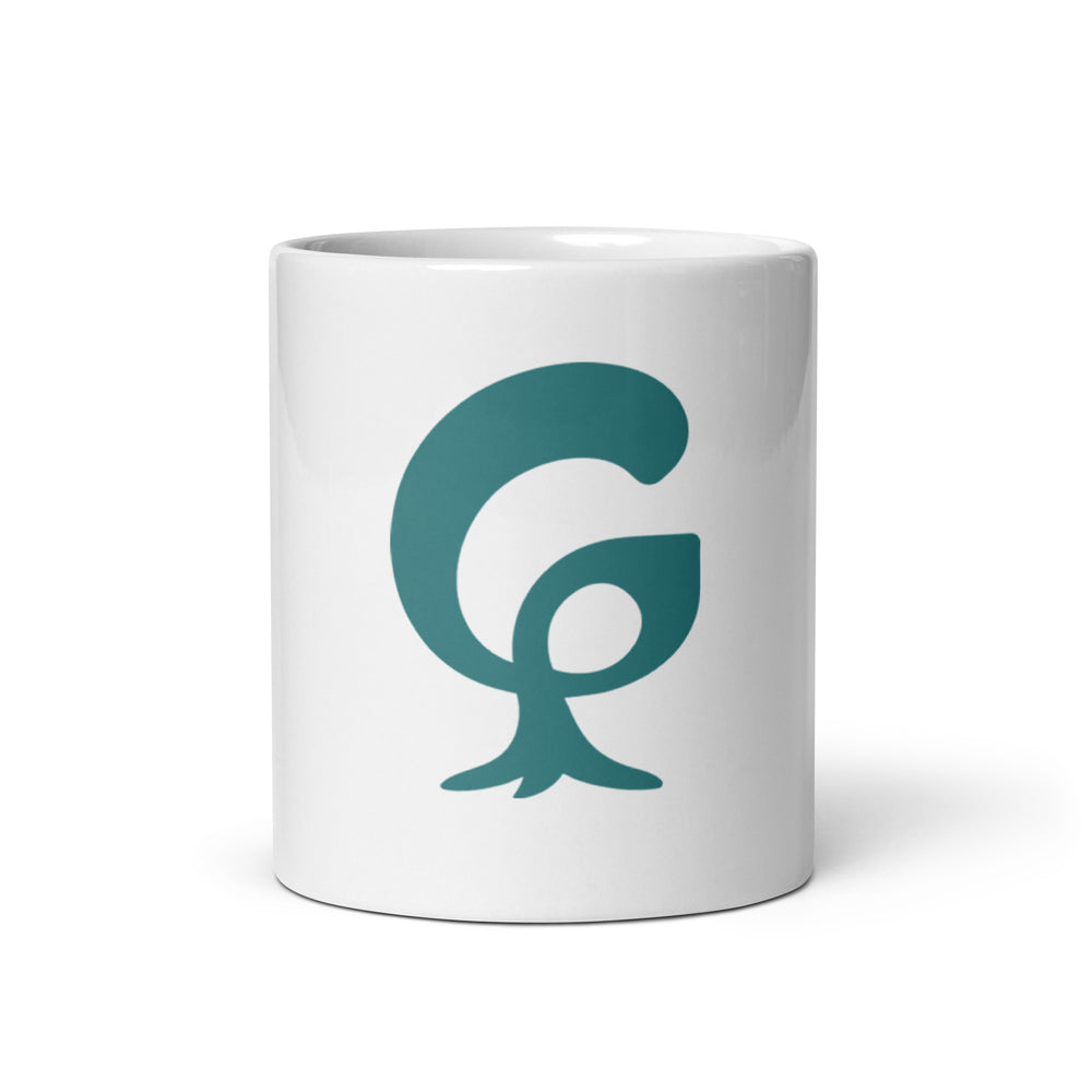 Big organic graphic G printed in teal on a white glossy ceramic mug