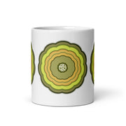 White glossy mug with 3 yellow and green graphic blooms on a white background