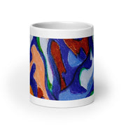 White mug with a colorful abstract design on a white background