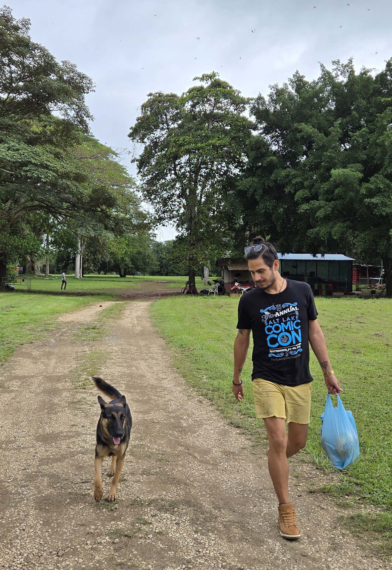Ismael Espinoza with his dog on a mango walk, Costa Rica, Summer, 2024.